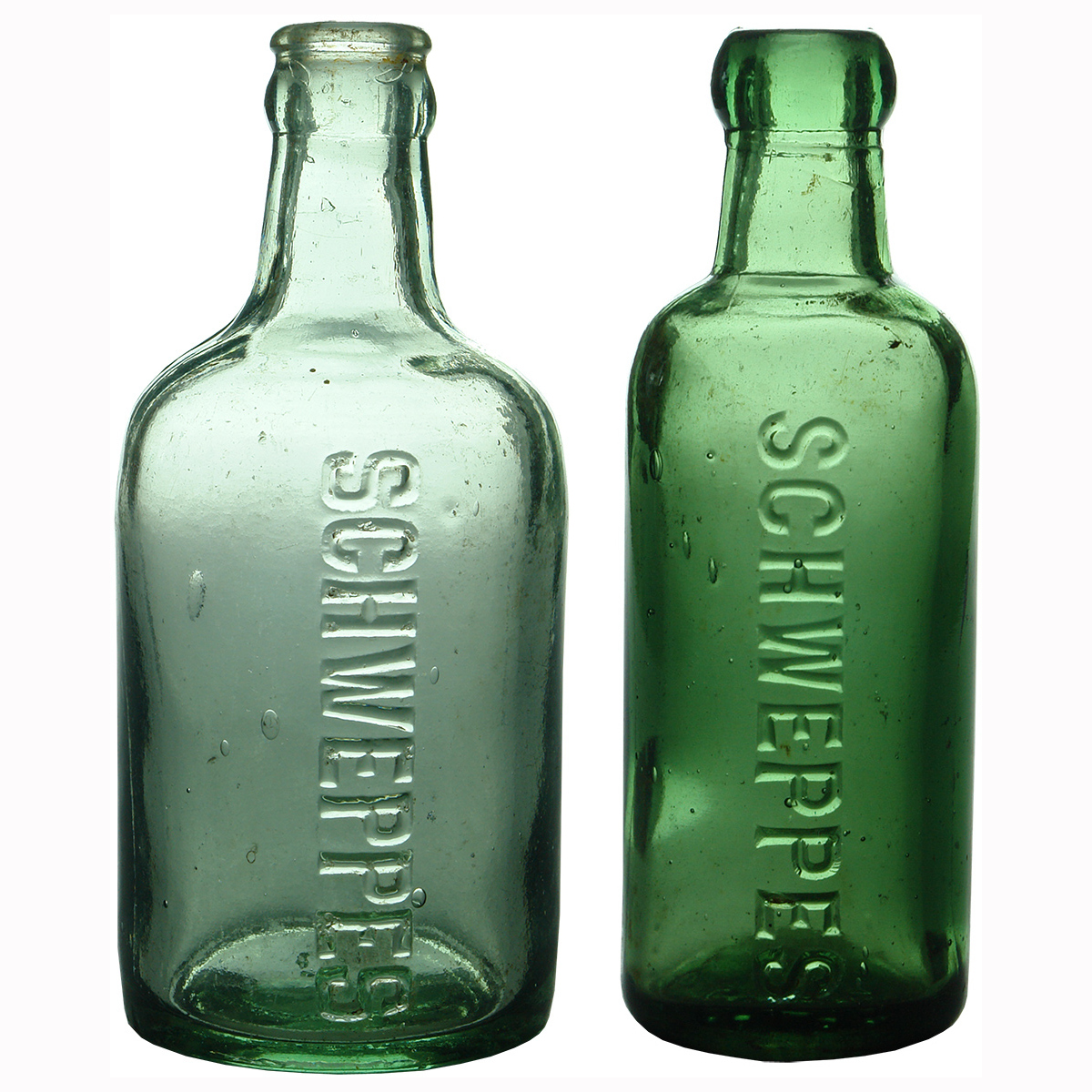 2 unusual Schweppes Soft Drink Bottles.